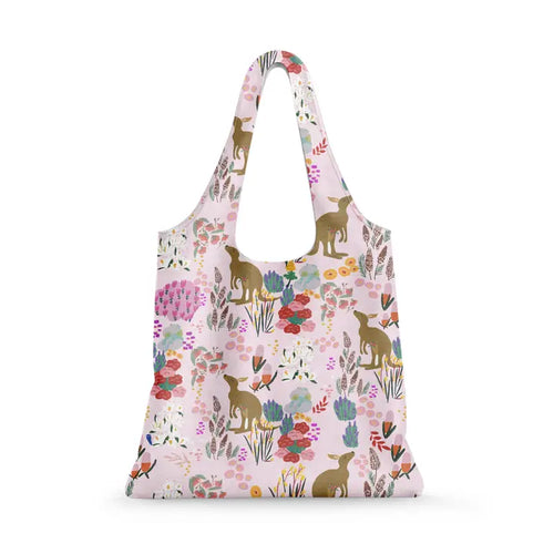 The Pink Kangaroo Reusable Shopping Bag by Blue Dog Posters features kangaroos, colorful flowers, and plants on a light pink background. This eco-friendly bag has a wide handle and soft shape—ideal for everyday use.