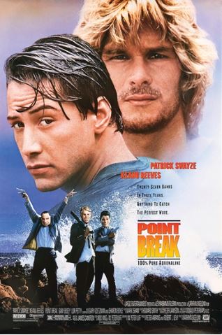 MTV 107's "Point Break" poster shows two men with serious expressions in a close-up, waves in the background, and four armed men in suits running on a beach.