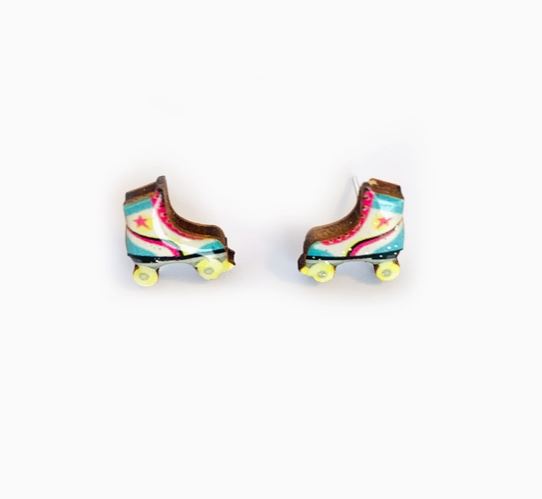 The Blue Dog Posters "80s Roller Boot Retro Stud Earrings" are colorful studs shaped like roller skates, featuring a blue, white, and pink design with a yellow star and yellow wheels on a plain white background.