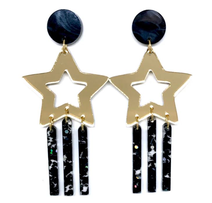 Shooting Star Earrings Large offer a stunning design with gold star frames and dangling textured black bars set on round black bases. Created with Blue Dog Posters' unique style, these earrings combine acrylic and stainless steel for an elegant, timeless look.