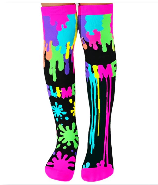 Introducing the Madmia Slime Socks by Blue Dog Posters: a vibrant pair of neon slime-themed knee-high socks. These predominantly black socks feature bright splashes of pink, green, blue, and yellow, with "SLIME" boldly written in multicolored letters on each sock. The toes are a striking bright pink. Designed to fit most sizes and best maintained with a cold hand wash only.