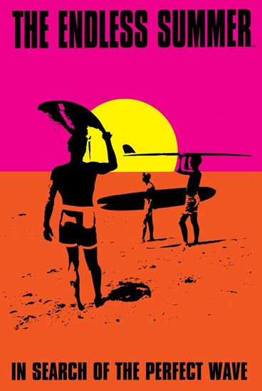 Silhouetted surfers carrying boards appear against a vibrant pink and orange sunset backdrop. At the top, the text reads "The Endless Summer," and at the bottom, "In Search of the Perfect Wave." This image can be found on the Blue Dog Posters product titled "The Endless Summer 28x43cm.