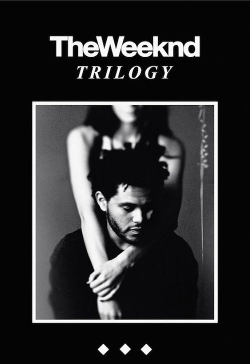 Introducing the black and white album cover for "The Weeknd - Trilogy" by MUS 072. It features a man looking down with a woman standing behind him, her arms draped over his shoulders. The album title appears above the image, making it an essential R&B poster for any music collection.
