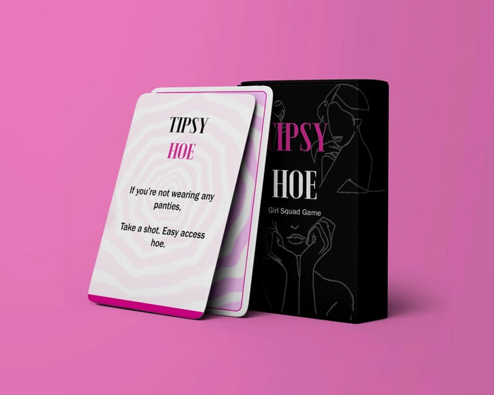 The Tipsy Hoe Card Game by Blue Dog Posters is shown on a pink background, featuring a card that says: "If you're not wearing any panties, take a shot. Easy access hoe.