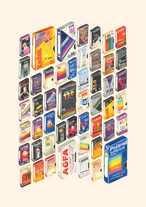 A colorful assortment of vintage VHS and cassette tape boxes arranged in a grid pattern against a plain background, featuring brands like Kodak, TDK, Sony, AGFA, Maxell, and Polaroid. This collection showcases various designs and labels from past decades as seen in "50 Up: VHS Memories by Amy Blue," brought to you by fap.