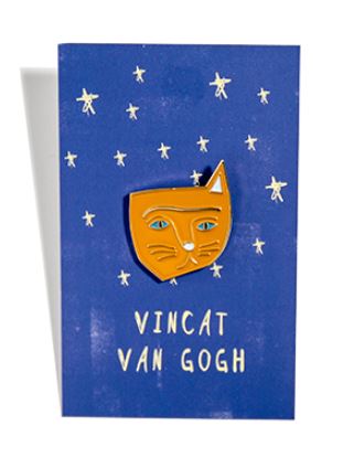 A greeting card features a blue background adorned with white stars. At the center, it displays the Vincat Van Gogh Enamel Pin, designed by Nia Gould and brought to you by Blue Dog Posters. Below the cute orange cat face enamel pin, "VINCAT VAN GOGH" is written in white, cleverly resembling the famous artist Vincent Van Gogh's name.