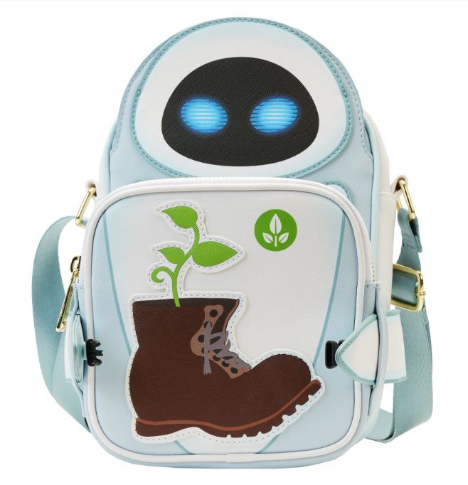A light blue backpack designed to resemble a robot with glowing blue eyes, featuring a front pocket embroidered with a brown boot and green plant, along with a small green emblem showcasing a leaf icon. This Wall-E Date Night Crossbuddy Backpack by Blue Dog Posters is crafted from vegan leather and includes gold hardware and an adjustable strap.