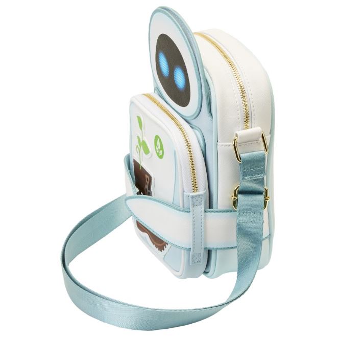 The Wall-E Date Night Crossbuddy Backpack from Blue Dog Posters is a small, white, and light blue backpack designed to resemble a robot with round blue eyes and a budding plant graphic on the front pocket. This Disney-Pixar merchandise features a top zipper closure, side straps, and an adjustable shoulder strap.