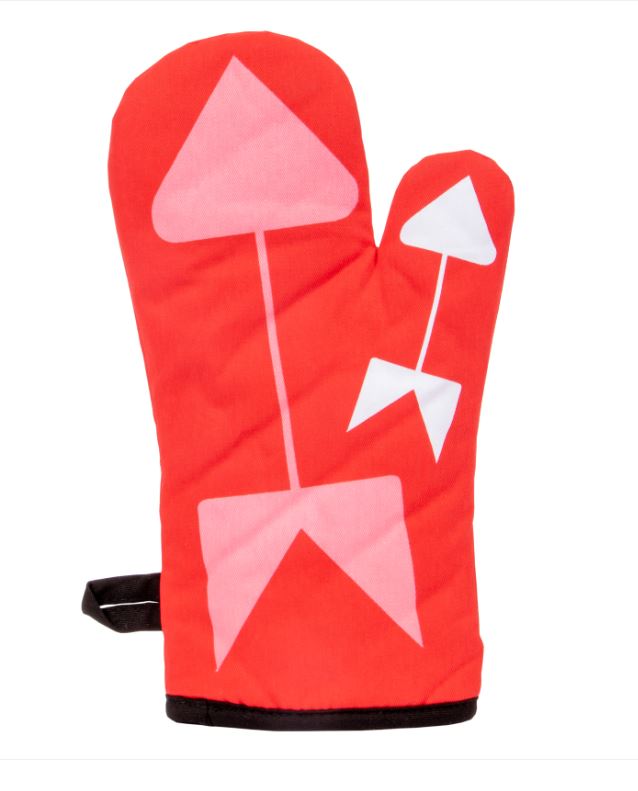 A super-insulated red oven mitt by Blue Dog Posters, named "Oven Mitt - Whatever Happens," adorned with abstract pink and white geometric shapes, including an arrow pointing upwards on the main section and a smaller, similar arrow on the thumb section. The mitt also features a black loop for hanging.
