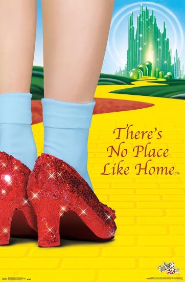 A figure wearing blue socks and gleaming red shoes stands on a yellow brick road. In the distance, an emerald city emerges against a blue sky. The image is accompanied by the text, "Wizard of Oz - No Place Like Home" by MTV 051.