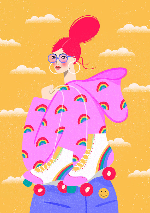 In the "Rainbow Roller" illustration by Kitty O Illustrates from A5, a person with bright red hair in a high bun is depicted wearing large hoop earrings and glasses. They are dressed in a pink hoodie featuring rainbow patterns and have roller skates around their neck. Their blue jeans display a smiley face and the scene is set against a yellow background with clouds.