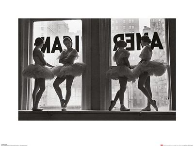 Four ballerinas in tutus pose gracefully in front of large windows, a cityscape backdrop framing their elegance. Two stand poised in the windows while two remain on the floor, with "AMERICA" partially visible on the glass outside. This black-and-white image titled "Time Life - Ballet Dancers in Window" by MEZ is a striking addition to any Large Decor Series Art Prints collection.
