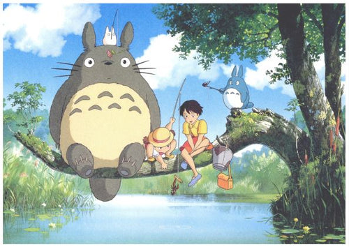 A scene from "My Neighbor Totoro" shows the large, gray creature Totoro sitting on a tree branch with two children and a small blue Totoro. They are fishing over a pond surrounded by lush greenery, with blue skies and white clouds overhead. Perfect for an Anime Totoro Tree poster printed on high-quality 250gsm satin paper by A3.