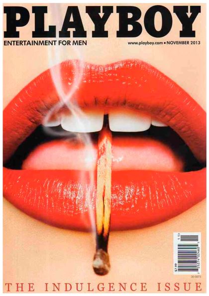 Cover of Playboy magazine's November 2013 issue, titled "The Indulgence Issue," prominently features the product "Playboy Match" by Brand Y. In a style reminiscent of a sexy vintage poster, the cover displays a close-up of bright red lips gripping a lit matchstick between the teeth, with smoke rising above. The text includes "PLAYBOY" and "ENTERTAINMENT FOR MEN.