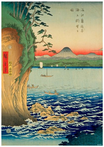 A traditional Japanese woodblock print, presented as an A3 **Kunisada Fuji Rocks** on 250gsm satin paper, depicts a coastal scene with a steep, rocky cliff, turbulent blue waves, and boats on calm water. The background features a snow-capped mountain under an orange and blue-toned sky adorned with Japanese calligraphy by **Blue Dog Posters**.