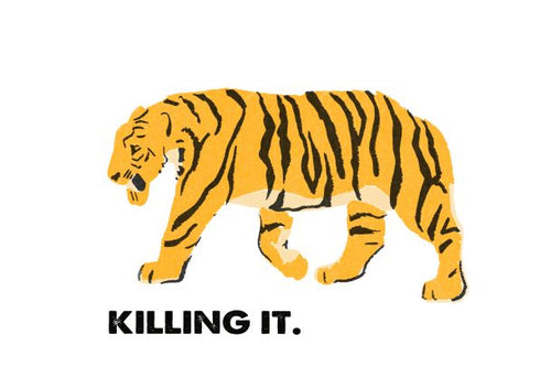 Illustration of a tiger walking to the left against a plain white background. Below the tiger, the bold black text reads "KILLING IT." The tiger is depicted in vibrant yellow and orange hues with black stripes. This piece is part of Blue Dog Posters' Retro Animal Print A5 collection, titled "Tiger - Killing It.