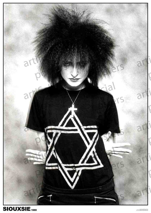 A person with voluminous, spiked hair poses against a textured background. They wear dark makeup and a black T-shirt featuring a prominent Star of David design. Their hands are held behind their back, showing only striped sleeves. The text at the bottom reads "Siouxsie - 1980 Colour: Rock," making it a perfect addition to any rock poster collection from the MUS 332 brand.