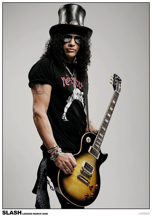 A person wearing a black top hat, dark sunglasses, and a black T-shirt, holding a yellow and black electric guitar. They have long curly hair and several tattoos visible on their arms. The text at the bottom reads, "SLASH LONDON MARCH 2008". This rock poster is part of our MUS 092 music collection printed on premium 150gsm gloss paper and is titled "Slash London".