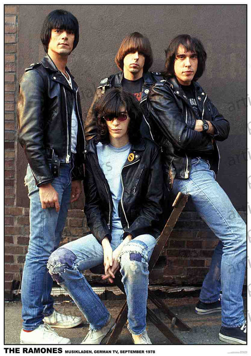 Four men are posed against a brick wall, with three standing and one seated on a chair. They are dressed in leather jackets, jeans, and sneakers, embodying a punk rock style. The caption reads, "THE RAMONES MUSIKLADEN, GERMAN TV, SEPTEMBER 1978." Titled "Ramones Germany 1978" by MUS 044, this piece would make a perfect addition to any music collection.