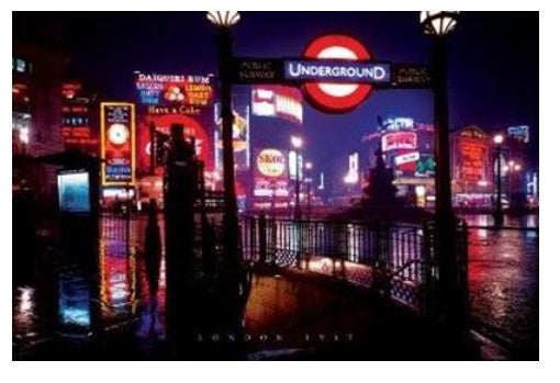 A vibrant nighttime scene at Piccadilly Circus in London, featuring an illuminated "Underground" sign at a subway entrance. Bright neon signs and advertisements, including Coca-Cola, light up the wet streets. Reflective puddles add to the lively urban atmosphere, perfect for a London UK - Night NAT 064.