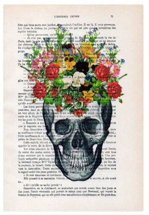 An artistic illustration of a skull is superimposed on a page from antique French books. A colorful bouquet of various flowers and greenery emerges from the top, creating unique prints that give the appearance of the flowers growing out of it. This product is known as Antique Book Print 15x21cm Skull Flower by ABP.