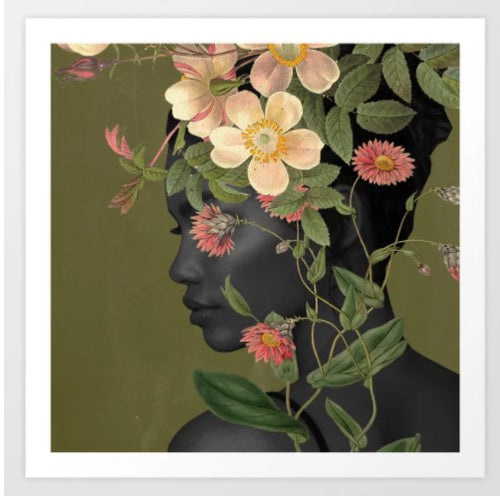 A side profile of a woman with dark skin is depicted against a muted green background. Her head merges seamlessly with an artful array of pink and white flowers and green foliage, creating a harmonious blend of human form and nature. This exquisite Bloom by Dada22 Art Print is part of the GAP Gallery Series, rendered on archival paper.