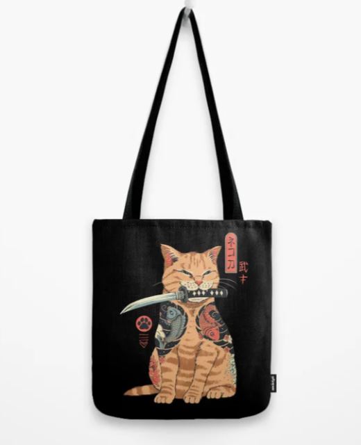 The Blue Dog Posters "Tote Bag 40x40cm Catana" is a sublimation printed black tote that showcases an illustrated orange tabby cat adorned with intricate tattoos. The cat, holding a sword in its mouth and flanked by Japanese characters, merges traditional and modern design elements. Perfect for adding to any giftware collection.