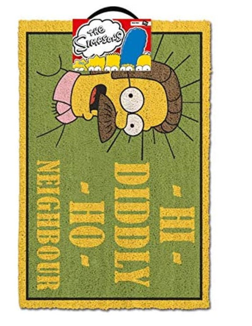 A vibrant green rectangular door mat from Blue Dog Posters, featuring Ned Flanders from "The Simpsons" upside down, with the text "HI - DIDDLY - HO - NEIGHBOUR" in yellow uppercase letters around the image. Crafted from durable coir, it includes a tag displaying "The Simpsons" logo at the top. It is known as The Simpsons Neighbour Doormat.