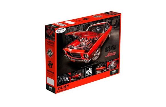 A Holden -1972 HQ Monaro 1000pc Puzzle from the Blue Dog Posters Giftware Collection featuring a classic red muscle car with its hood open. Officially licenced by Holden, the front of the box displays the brand name, 1000 pieces count, and completed puzzle image. The predominantly red box includes various photos of the car and puzzle details.