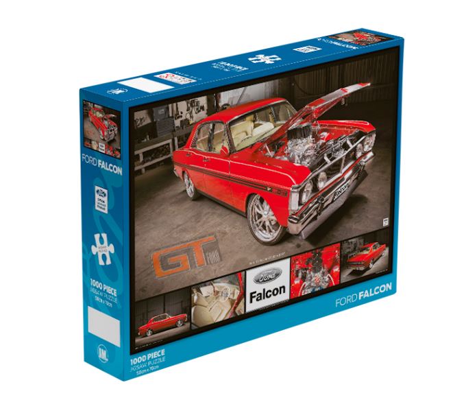 Box of a Ford Falcon 1000pc Puzzle by Blue Dog Posters featuring a red Ford Falcon car with its hood open, showing the engine. The box, part of the Giftware Collection, has a blue border and images of the car from various angles. "Ford Falcon" and "GT" are prominently displayed.