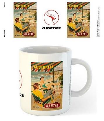 Part of our Homewares Collection, this Qantas - Beach Mug by Blue Dog Posters features a vintage Qantas Airlines poster depicting a man and woman lounging on a beach with umbrellas in Australia. The same poster is also shown as print versions around the dishwasher-safe mug. The Qantas logo is visible above the mug.
