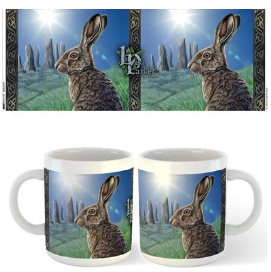 Part of our exclusive Homewares Collection, the Blue Dog Posters Lisa Parker Mug - Solstice features an illustration of a hare with long ears, set against a backdrop of standing stones and a bright, glowing sun. The hare and landscape design repeats on two sides of the mug, showcasing its stunning ceramic finish.