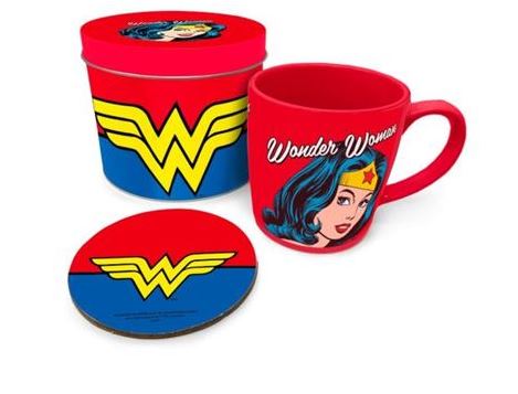 The Wonder Woman Mug and Coaster Tin Set by Blue Dog Posters includes a red coffee mug featuring an illustration of Wonder Woman's face along with the text "Wonder Woman." The set also includes a round coaster and a matching cylindrical container, both decorated with Wonder Woman's iconic yellow "W" logo against a red and blue background.