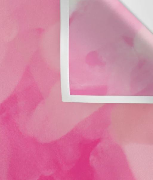 A close-up image shows the corner of a Pink Sky Laluntricotee Art Textile Sml by Blue Dog Posters, with the top right corner slightly curled. The colors transition smoothly, creating a soft, dreamy effect with various shades of pink blending together.