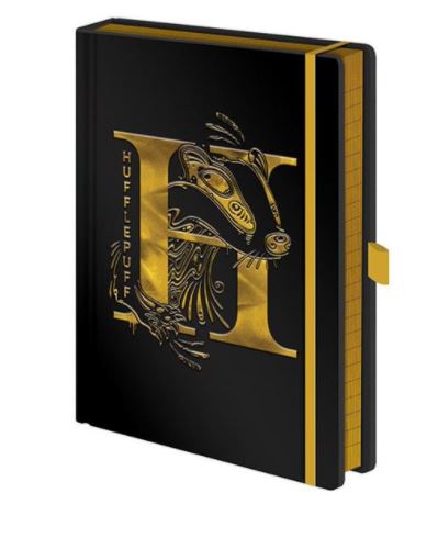 A high-quality hard cover black leather-bound notebook with a stylized gold "H" and badger design on the cover. The word "Hufflepuff" is written vertically along the left side. The edges of the pages are lined in gold, and there is a yellow strap closure on the right side—a must-have from our Stationery Gifts Collection, the Harry Potter Hufflepuff Premium Notebook by Blue Dog Posters.