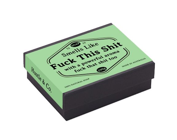 A rectangular soap box with a green label reads: "Smells Like 'Fuck This Shit' with a powerful aroma 'fuck that shit too.'" Infused with natural extracts, the label also includes "S2, D10, 100g, MADE IN AUSTRALIA, 100% NATURAL SOAP." The side of the box reads "Hustle & Co.," perfect for sensitive skin. The product name is Hustle and Co Soap - Fuck This Shit and it's by Blue Dog Posters.