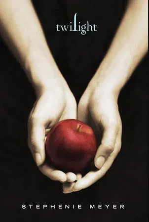 The cover of the Twilight Book Cover by IMP resembles a hit movie poster, featuring a pair of pale hands holding a red apple against a black background. The title "Twilight" is at the top in light blue text, and the author's name is at the bottom in white text.