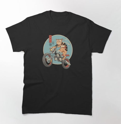 The Catana Motorcycle Tshirt in size LGE features a cartoon graphic of a cat wearing sunglasses and a leather jacket, riding a motorcycle against a circular background. The design includes some Japanese text on the left side. This super cool T-shirt is from Blue Dog Posters and comes in black.