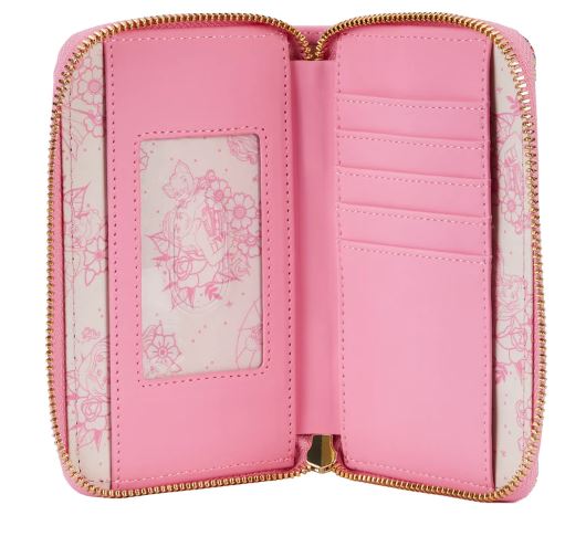 The Disney Princess Floral Tattoo Zip Purse by Blue Dog Posters is open to reveal its interior. On the left side, there is a clear ID slot with a floral print card inserted. On the right side, there are multiple card slots. The pink zippered vegan leather wallet is lined with white and pink floral print fabric, reminiscent of a classic Disney Princess Wallet.