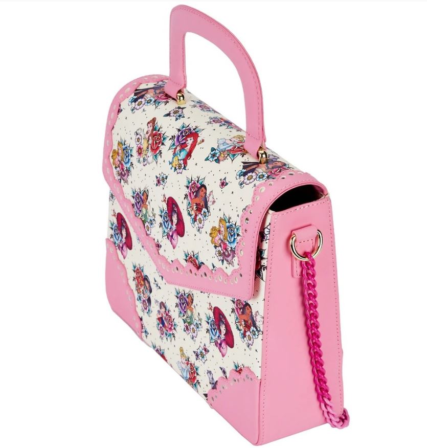 A stylish handbag with a pink handle and pink chain strap, the Disney Princess Floral Tattoo Crossbody by Blue Dog Posters features a colorful floral pattern on a white base with pink vegan leather edges and corners. The design is both elegant and modern, making it perfect for a vibrant fashion statement.
