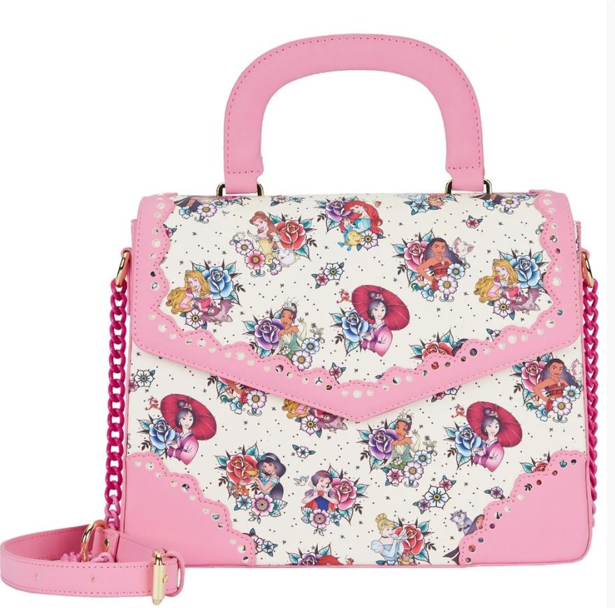 The Disney Princess Floral Tattoo Crossbody from Blue Dog Posters is a stylish accessory featuring a pink handle, trim, and chain strap. Crafted from vegan leather, it showcases a colorful floral pattern interspersed with illustrations of fairytale characters on a white background adorned with intricate and delicate designs.