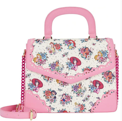 The Disney Princess Floral Tattoo Crossbody from Blue Dog Posters is a stylish accessory featuring a pink handle, trim, and chain strap. Crafted from vegan leather, it showcases a colorful floral pattern interspersed with illustrations of fairytale characters on a white background adorned with intricate and delicate designs.