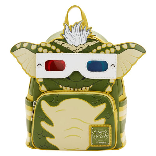 The Blue Dog Posters Gremlins Stripe Mini Backpack is a stylish, green and yellow accessory designed to resemble the iconic gremlin. It features large ears, a three-dimensional face with a tuft of white hair, and includes Funko Pop cosplay details like a front zipper pocket, adjustable straps, and 3D glasses attached to the top.