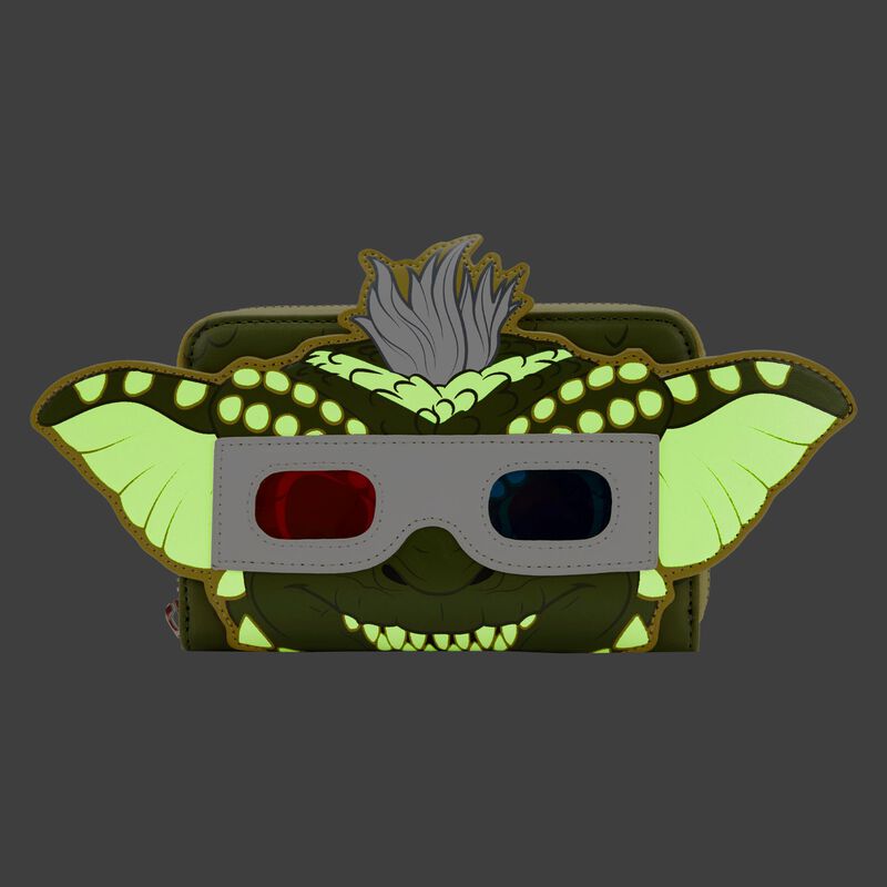 This Funko Pop! by Loungefly creation, named the "Gremlins Stripe Pop Purse," resembles a dark green purse designed like a creature with large ears, light green spots, and 3D glasses featuring one red and one blue lens. The bag includes ears and a faux fur tuft protruding from it, all set against a solid dark gray background. This unique item is proudly offered by Blue Dog Posters.