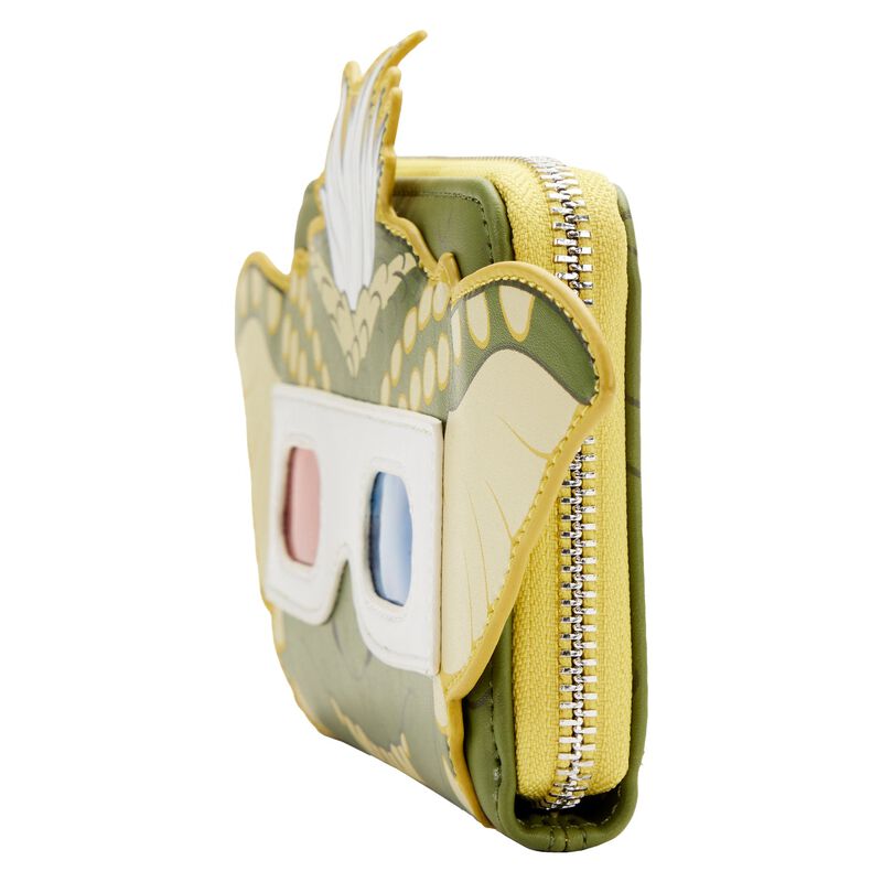 Introducing the Gremlins Stripe Pop Purse by Blue Dog Posters: a green and yellow wallet designed to resemble a character with large, white and pink 3D glasses, ears protruding from the sides, and white hair on top. This stylish accessory features glow-in-the-dark details, a zipper closure on the side, and boasts a playful, cartoon-like appearance.