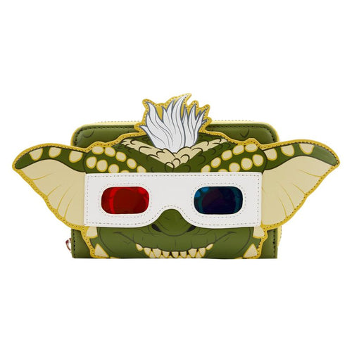 A small, green character-themed wallet featuring a detailed face with large ears, a white tuft of hair, and 3D red and blue glasses. This Gremlins Stripe Pop Purse by Blue Dog Posters adds whimsical glow-in-the-dark details for a playful and eye-catching design.