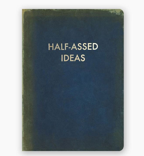 A dark blue, slightly worn notebook by Blue Dog Posters with the title "Half Assed Ideas Journal" printed in uppercase gold foil letters centered on the cover. This useful journal features dotted pages, perfect for organizing your thoughts.