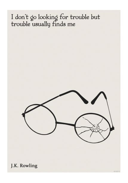 The "Looking for Trouble A5 Literary Print" from the A5 brand showcases a pair of broken round glasses with one shattered lens in a minimalist style. The top features the quote, "I don't go looking for trouble, but trouble usually finds me," and J.K. Rowling is credited at the bottom. This A5 print comes with Deluxe Postcard Frames against an off-white background.