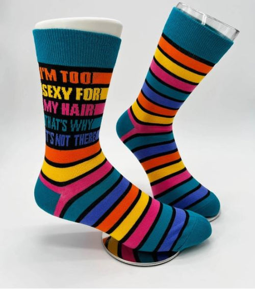 The Blue Dog Posters' Too Sexy for My Hair Socks Mens are a pair of stylish and comfortable men's novelty crew socks, featuring vibrant horizontal stripes in shades of blue, yellow, pink, orange, and purple. The calf area showcases the playful phrase "I'm too sexy for my hair, that's why it's not there" written in multiple colors. These socks are perfect for making a fun statement.