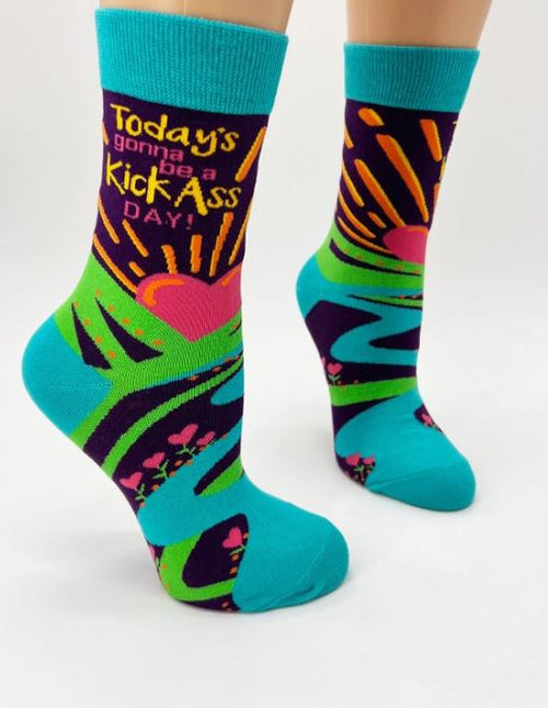 Stylish and comfortable, the Kick Ass Day Socks Ladies by Blue Dog Posters feature a vibrant design with a sunburst, heart, and bright path. The phrase "Today's gonna be a Kick Ass Day!" stands out against shades of green, purple, blue, and pink, making these socks perfect for adding some flair to your outfit.